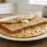 Quick and  Easy Healthy Breakfast Recipes 10-minute  featuring toasted whole wheat bread, creamy spread, and a perfectly cooked fried egg on a white plate for busy mornings