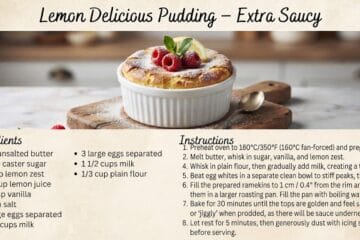 Lemon Delicious Pudding in a white ramekin dusted with icing sugar and garnished with raspberries and mint