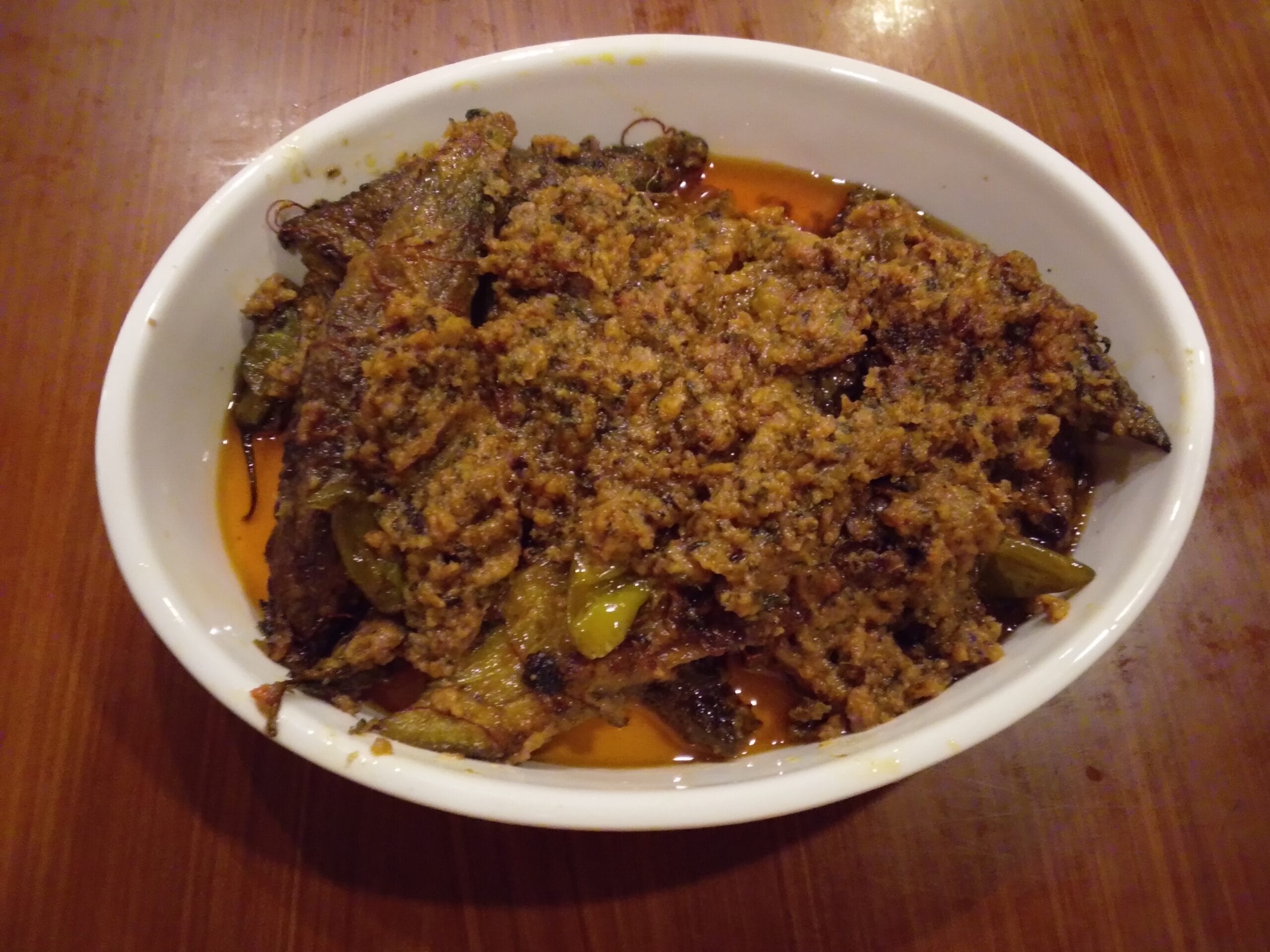 Delicious Masala Bharre Karele ready to serve in a wok with rich spices and tamarind twist