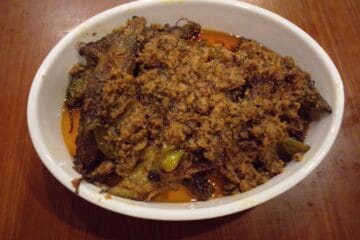 Delicious Masala Bharre Karele ready to serve in a wok with rich spices and tamarind twist